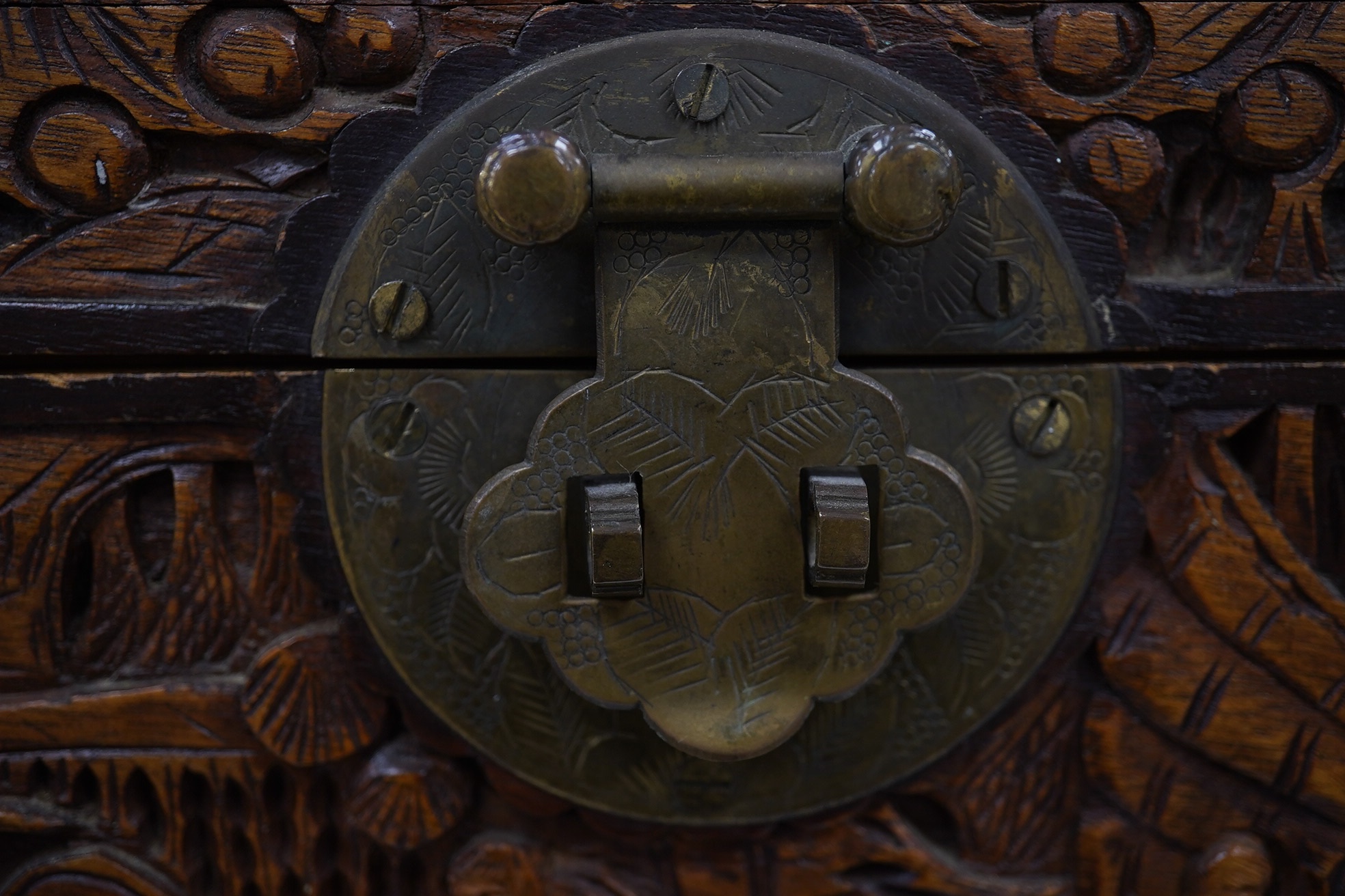 A Chinese carved small camphor box and an oak cased Mahjong set, camphor box 31cm wide x 17cm high. Condition - fair